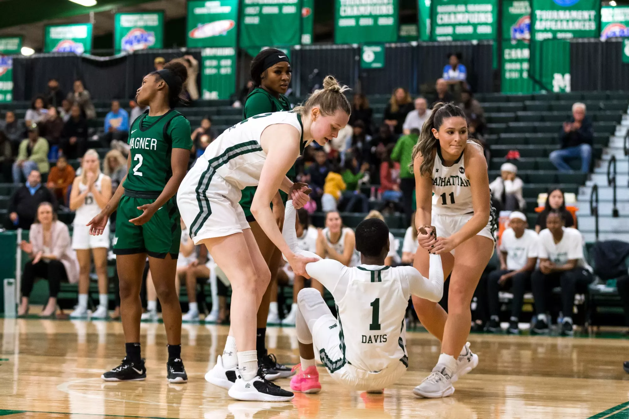 Emily LaPoint and Leyla Ozturk help Dee Dee Davis up off the floor