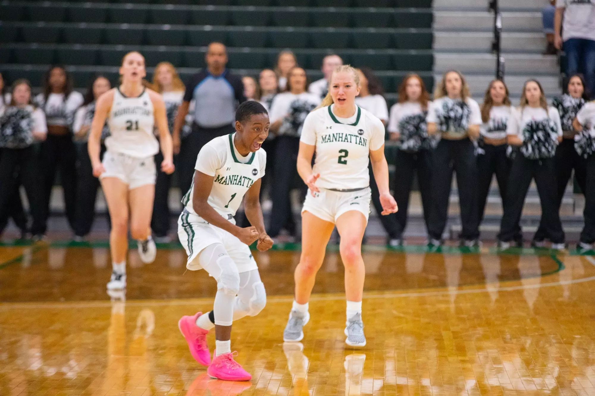 Dee Dee Davis and Anne Bair celebrate a win against Howard