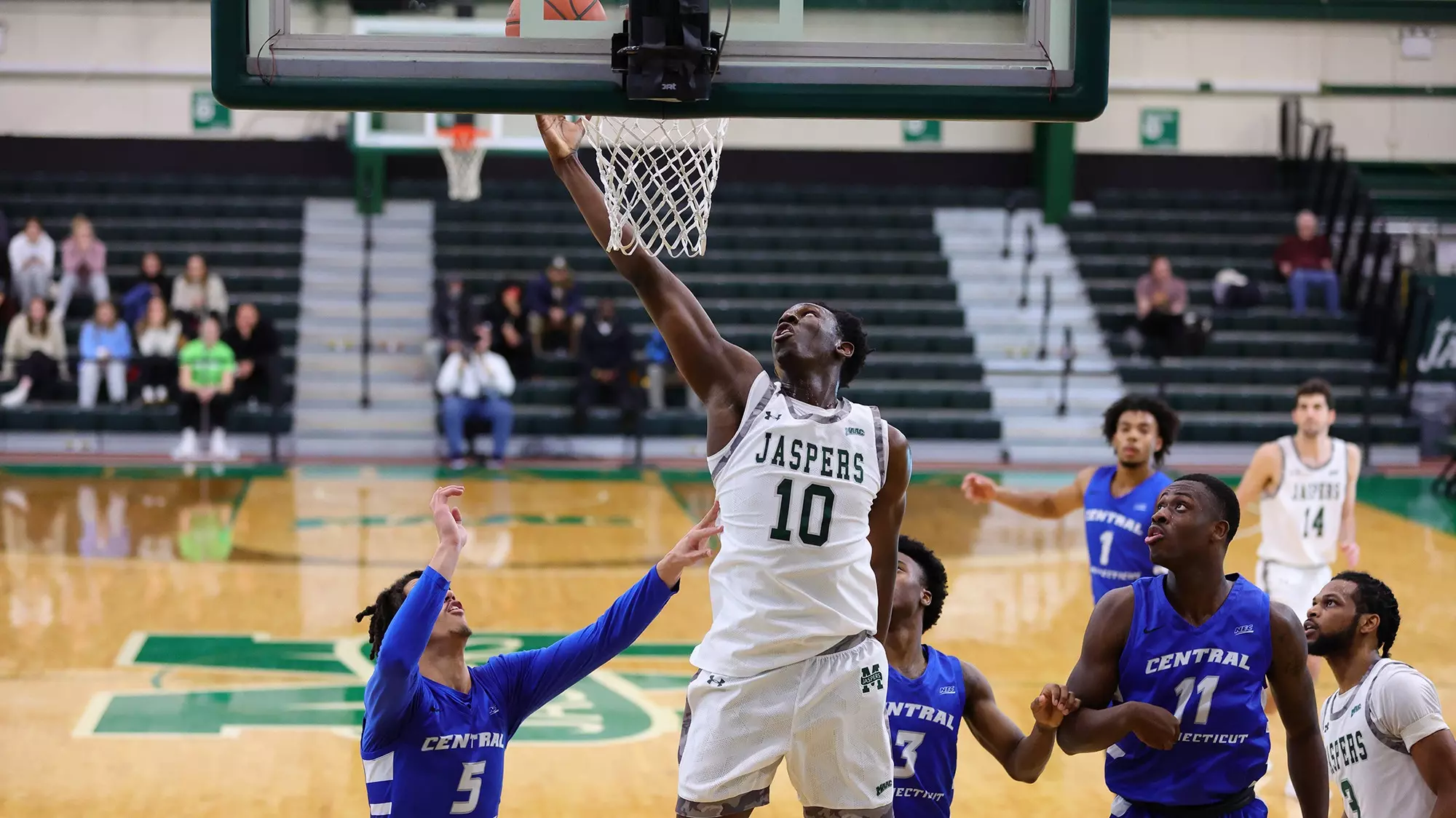 Adam Cisse grabbing a rebound against Central Connecticut