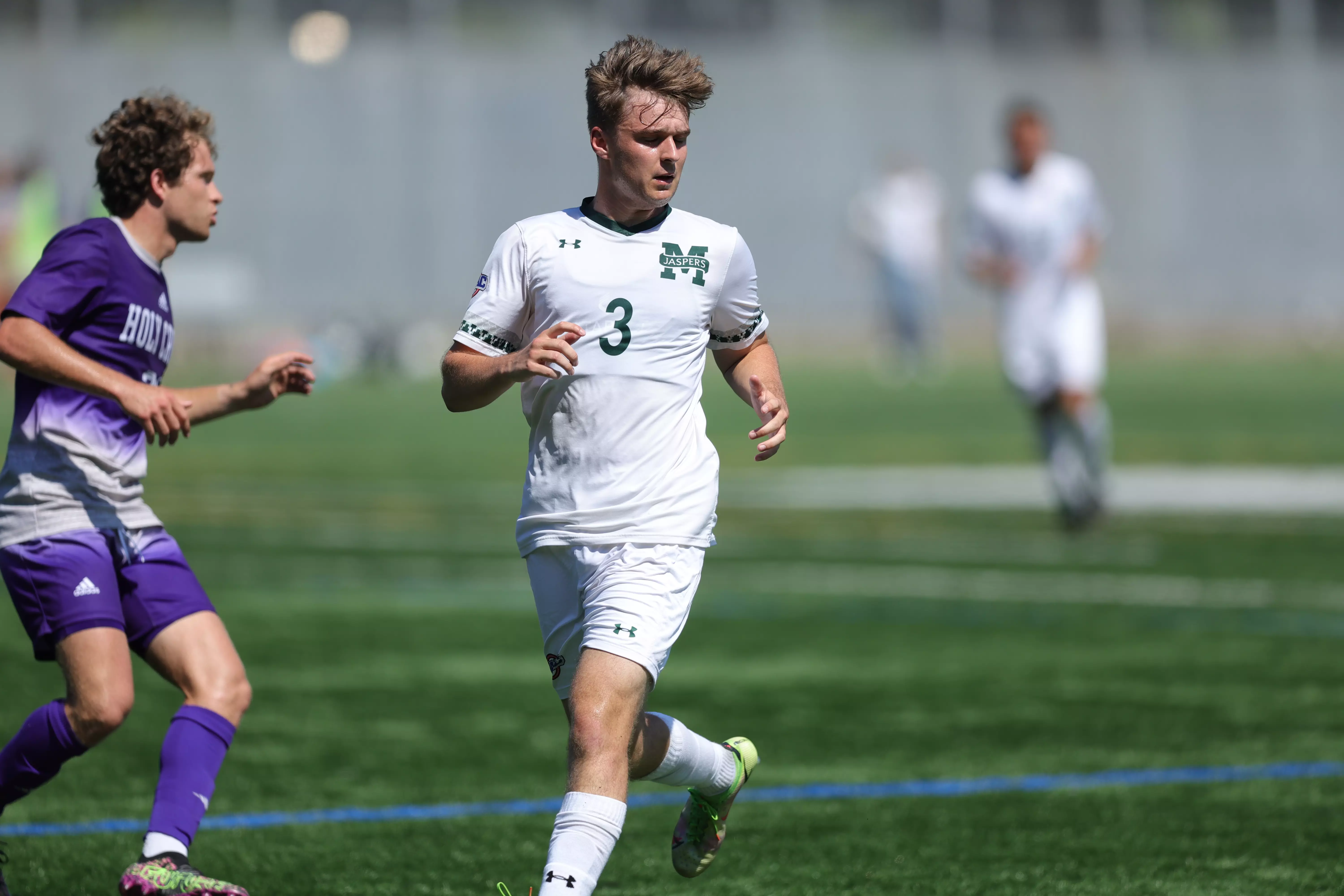 Harry Bark runs against Holy Cross