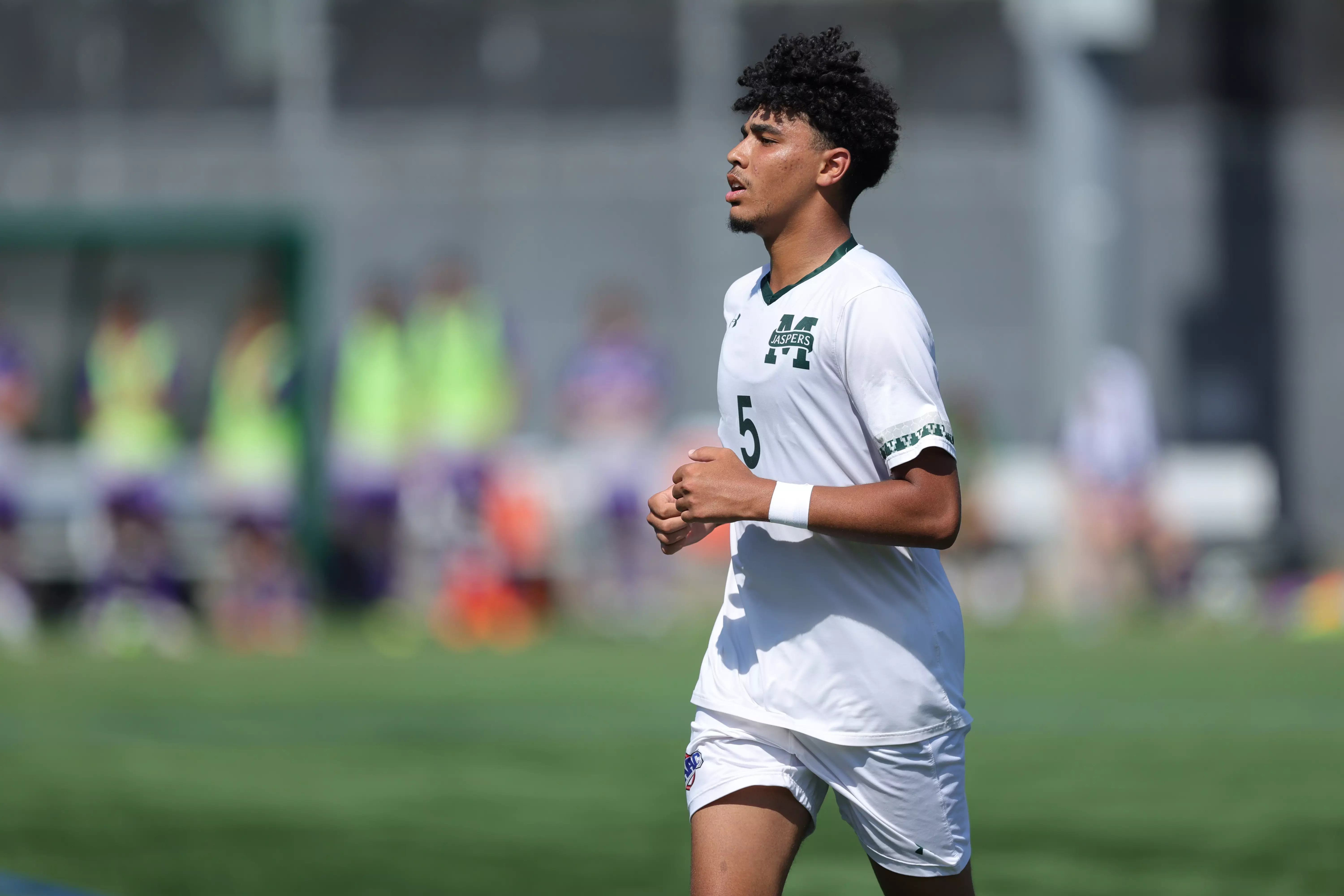 Nassim Akki moves upfield against Holy Cross