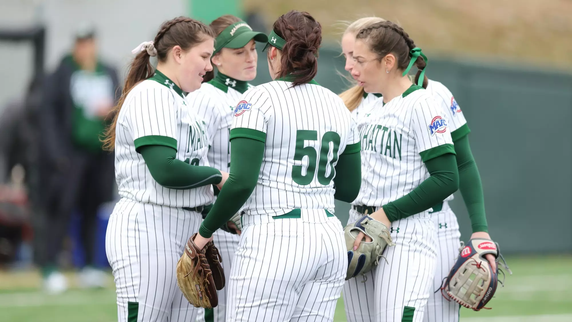 Infielders meeting before an innings
