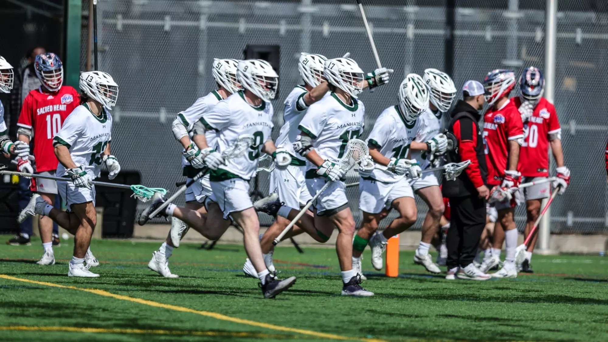 Men's lacrosse running onto the field vs Sacred Heart 2023