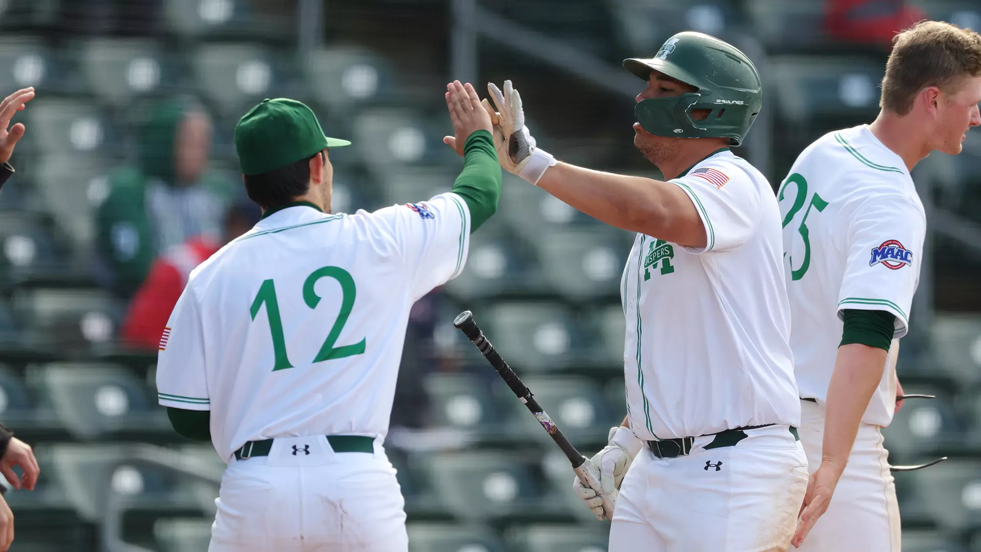 Alfredo Delgado and Logan Pfannenbecker high-five
