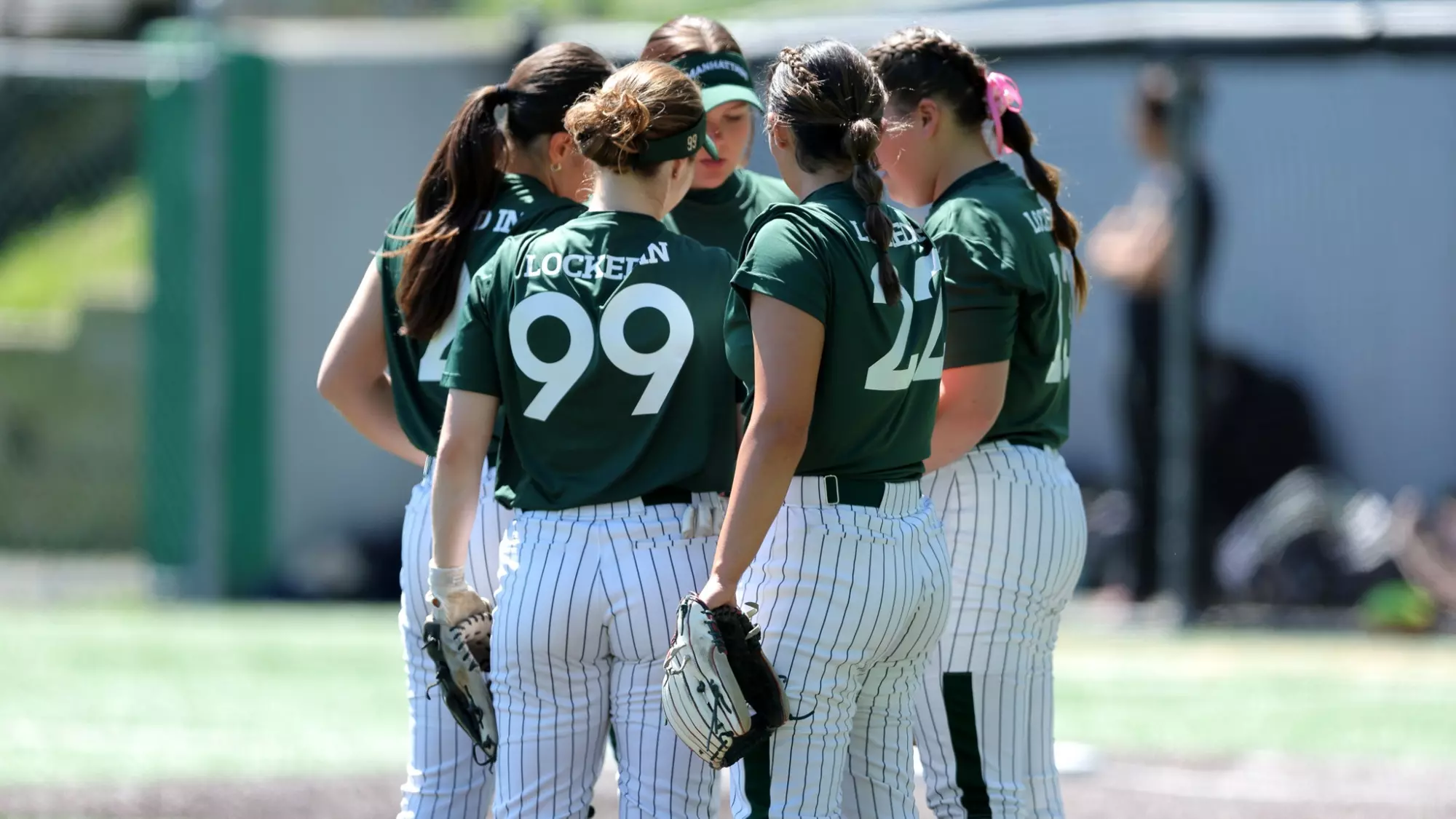 Softball huddle shot pre pitch